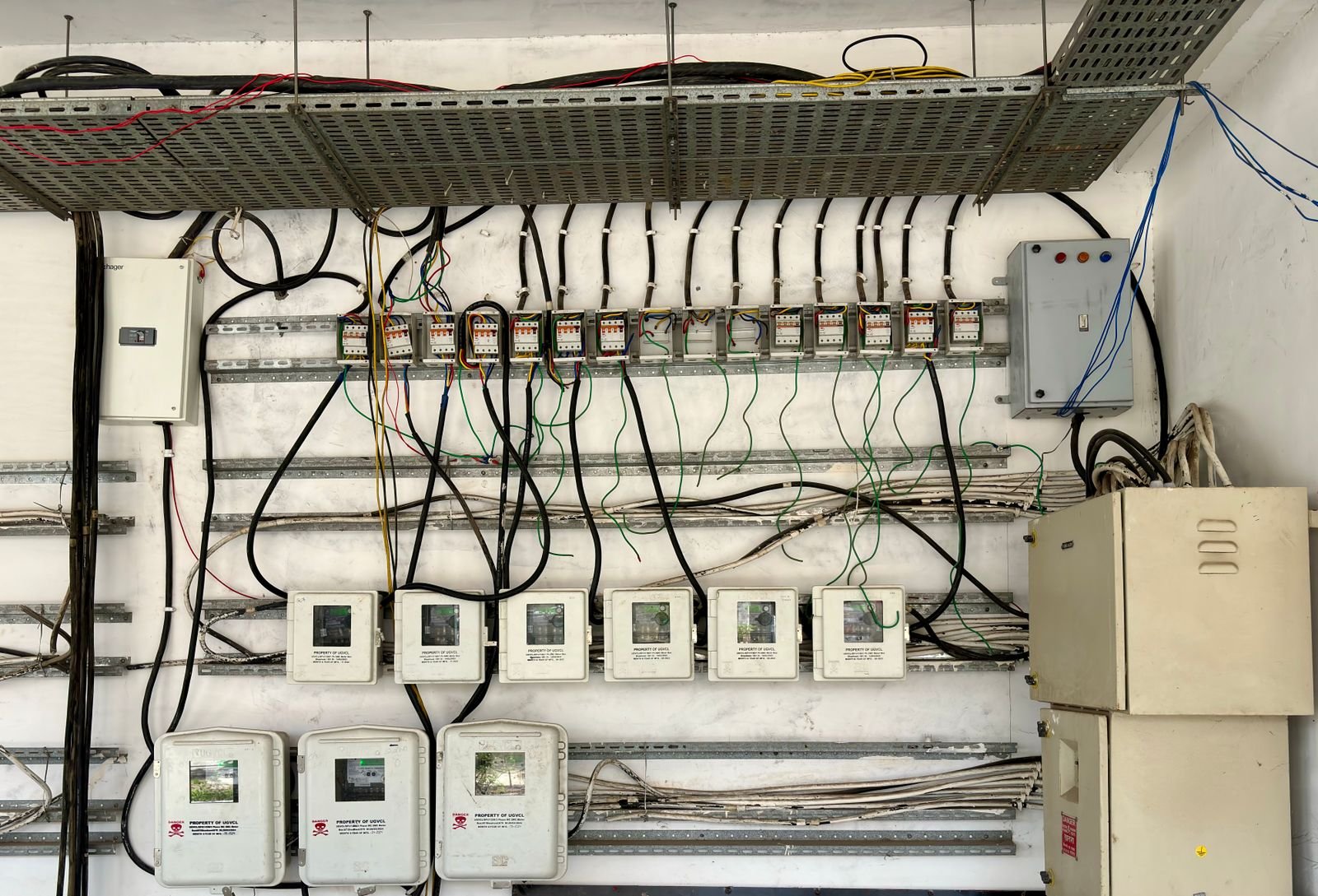A home transfer switch or V2H bidirectional charger mounted by an electrical panel