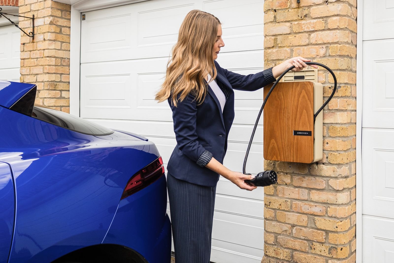 A single home battery mounted on a wall with space beside it for a second