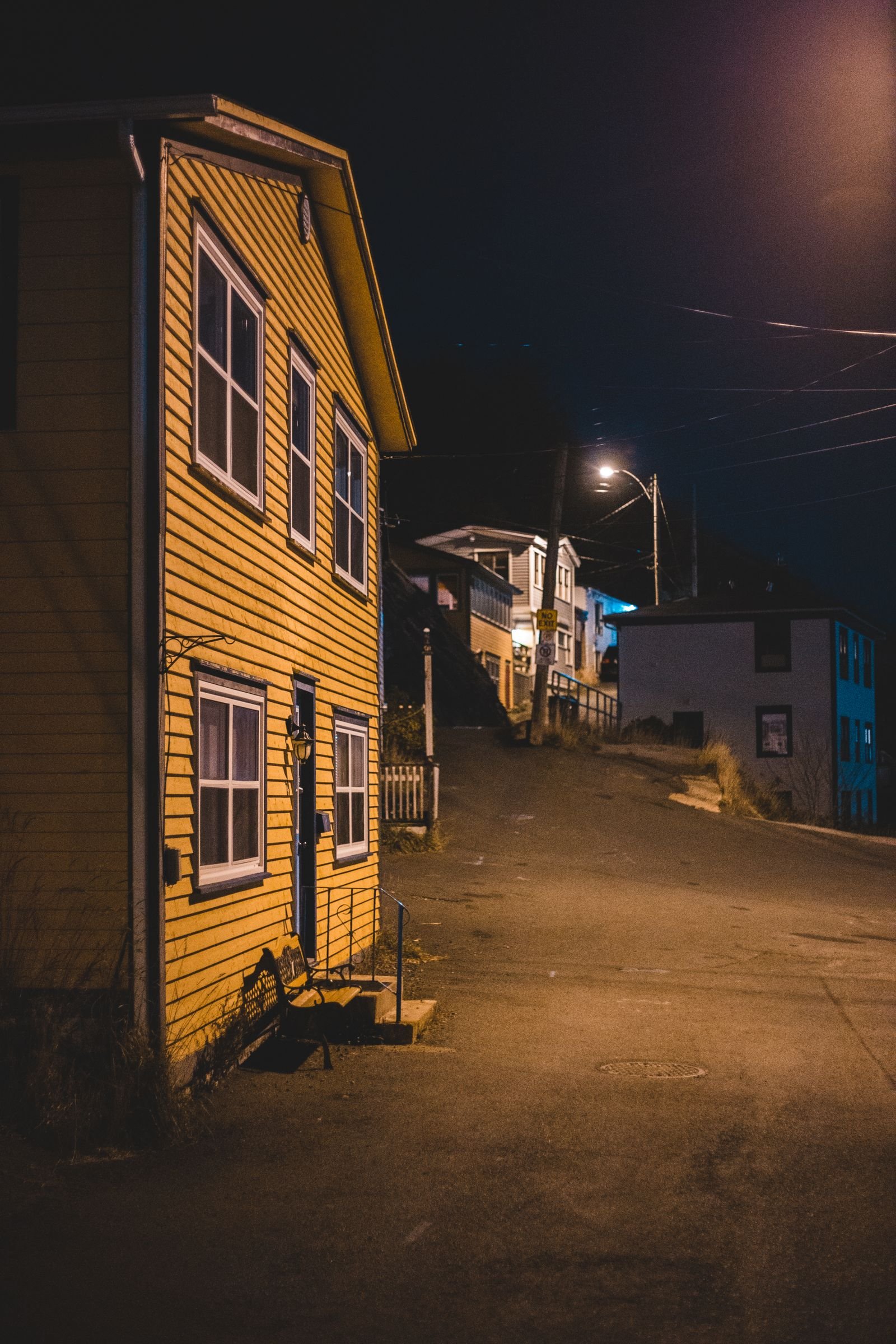 A lit home at night during a neighborhood outage