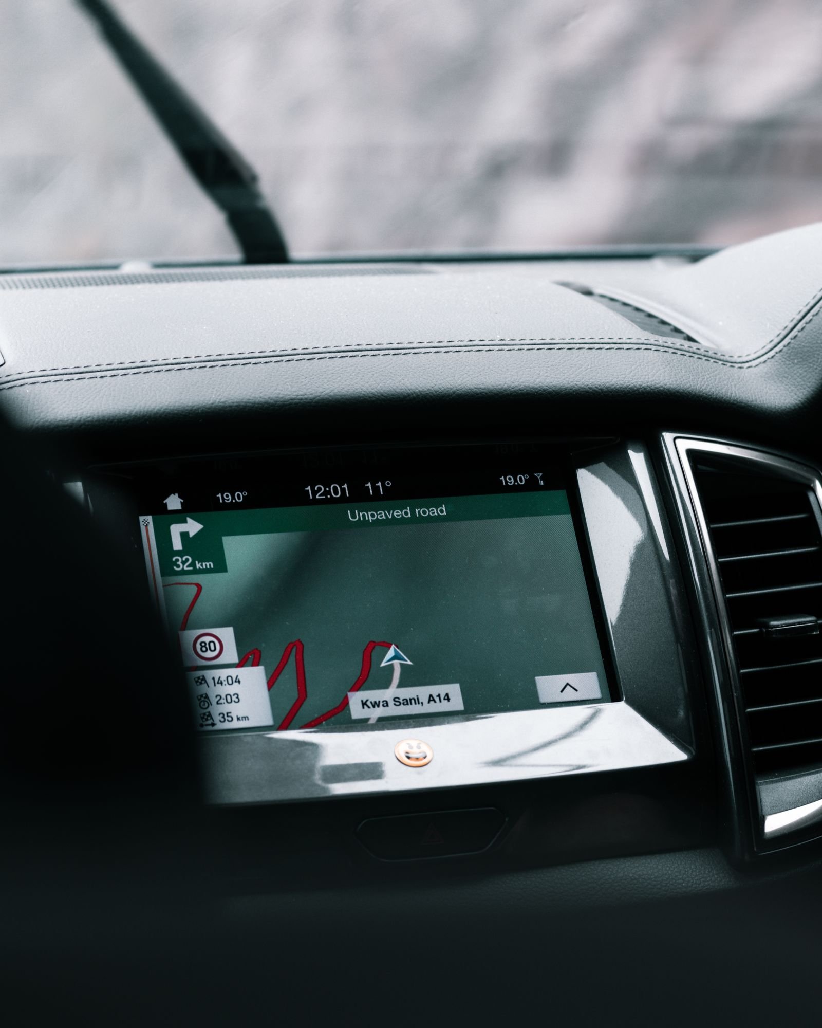 EV dashboard and phone app showing a scheduled preconditioning timer and a reduced winter range estimate