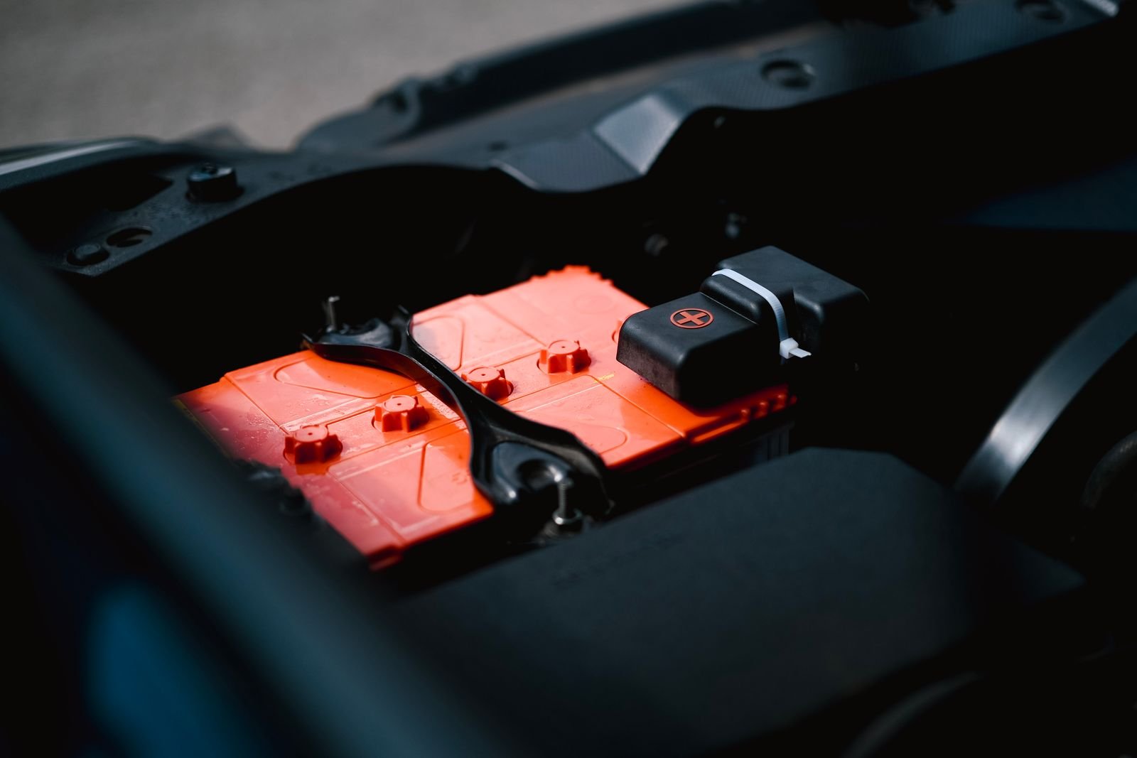 Side by side comparison of a wall-mounted home battery and an outdoor standby generator