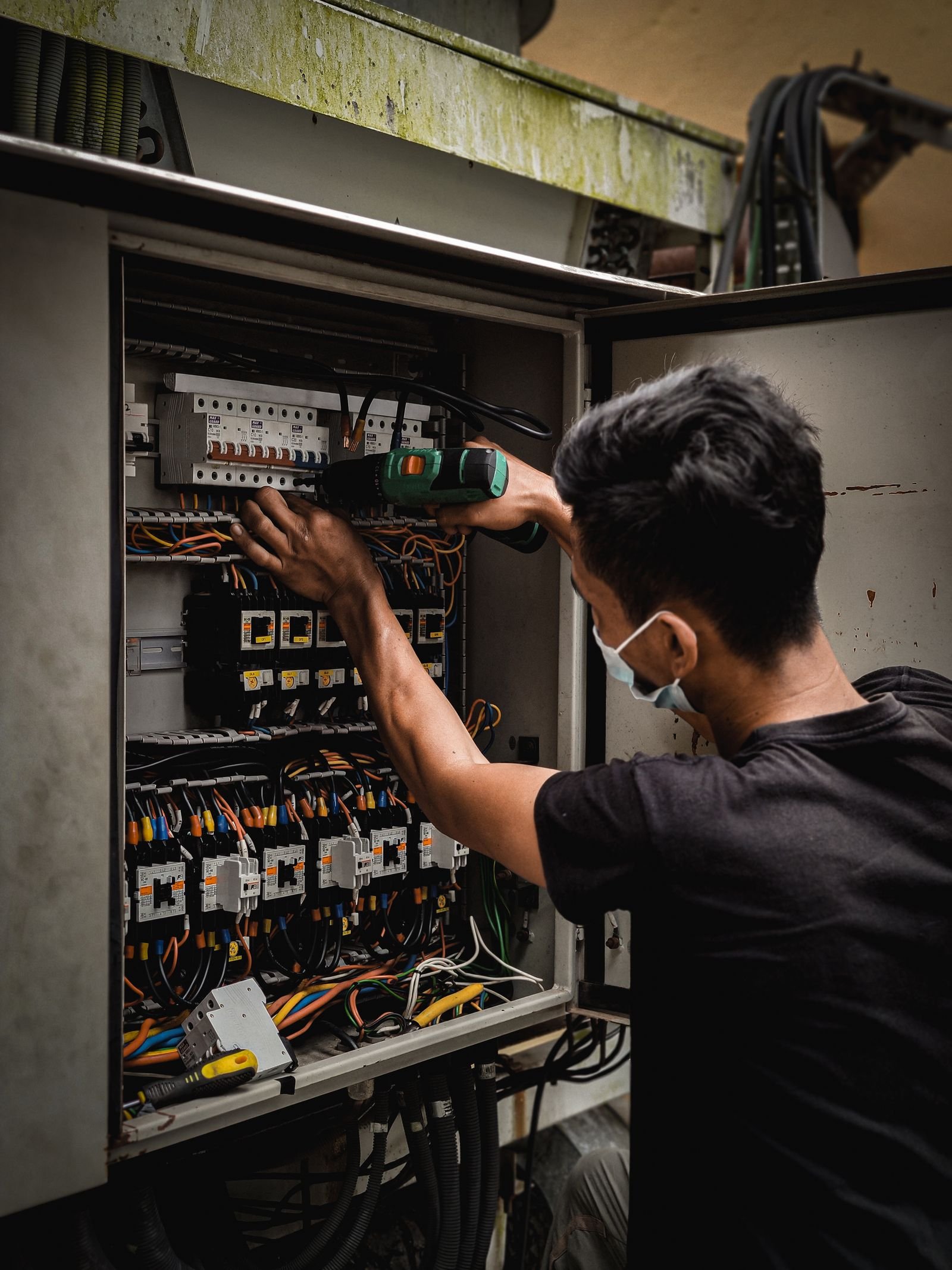 Installer performing a backup and islanding test at the home's electrical panel
