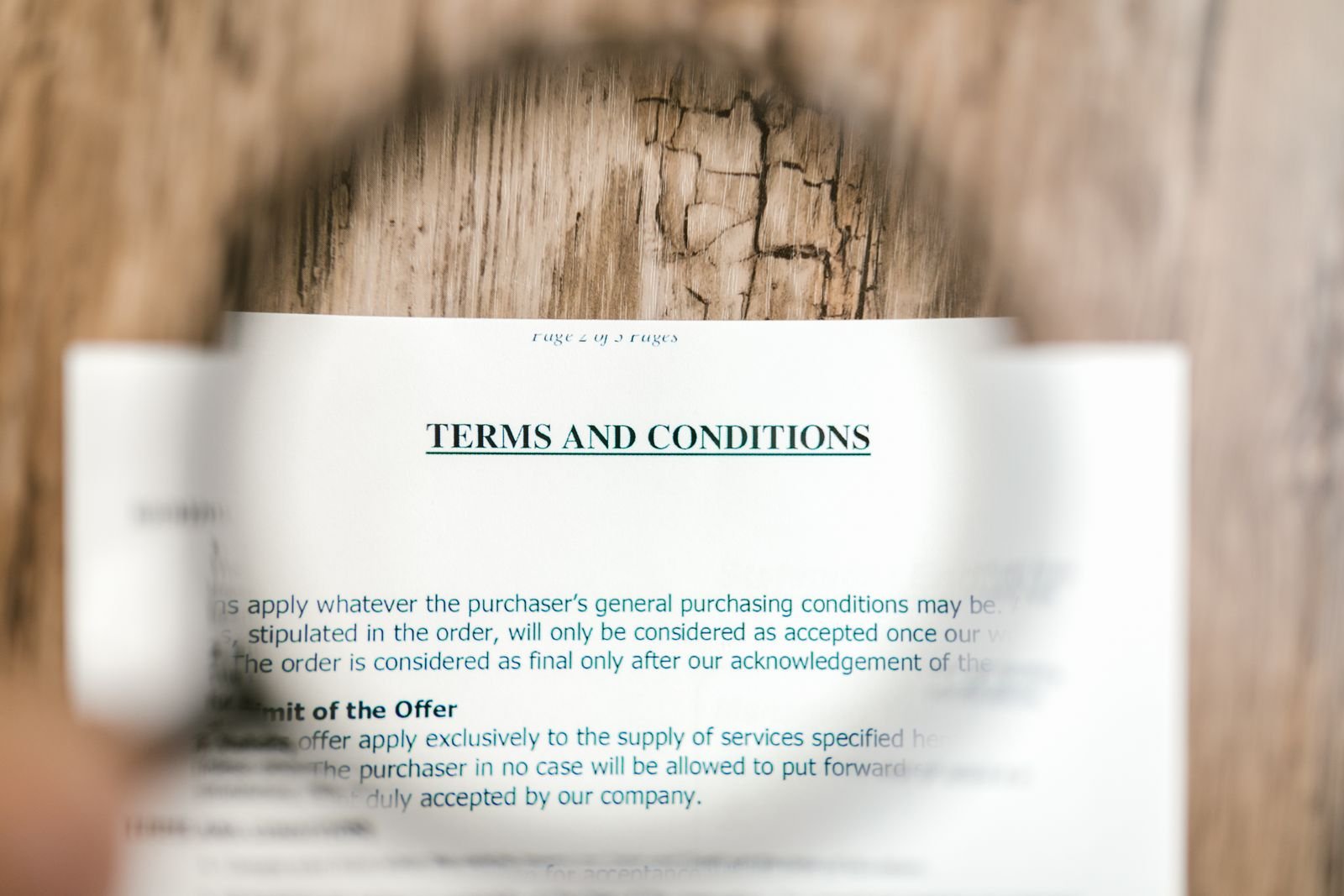 Close-up of a solar financing contract with escalator and dealer fee clauses highlighted in red
